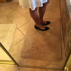 tanned legs and white skirt