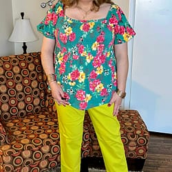Neon/lime colored trousers with floral top