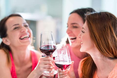 Girls drinking wine in restaurant