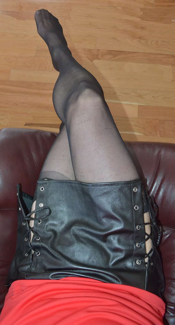 Relaxing in mini Skirt and stockings